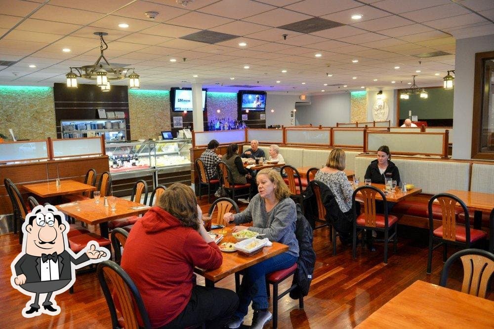 Guests dining inside Pita House in Medford
